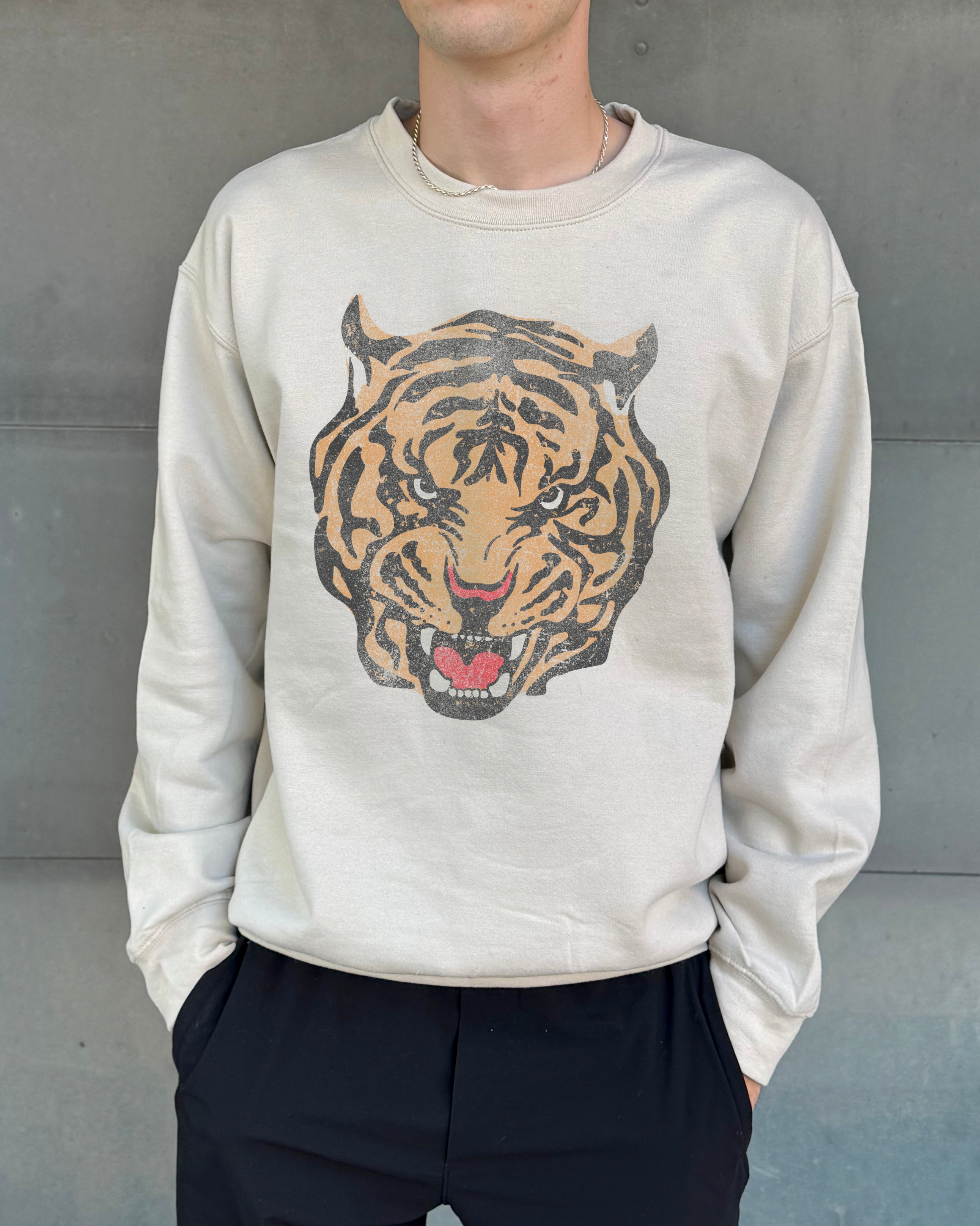 Sand colored pullover with tiger head tattoo image