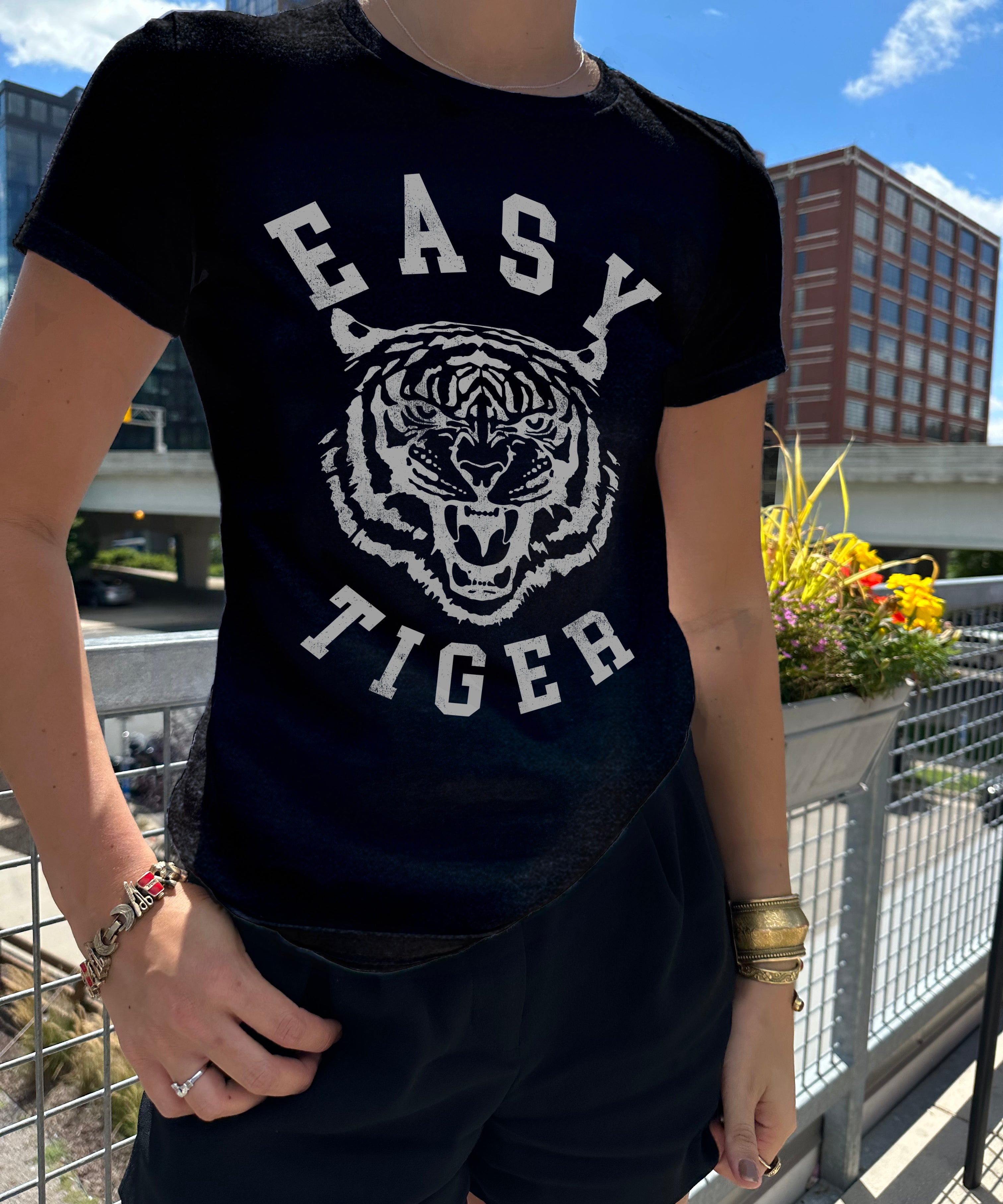 Easy tiger black tee in gray font with a tiger