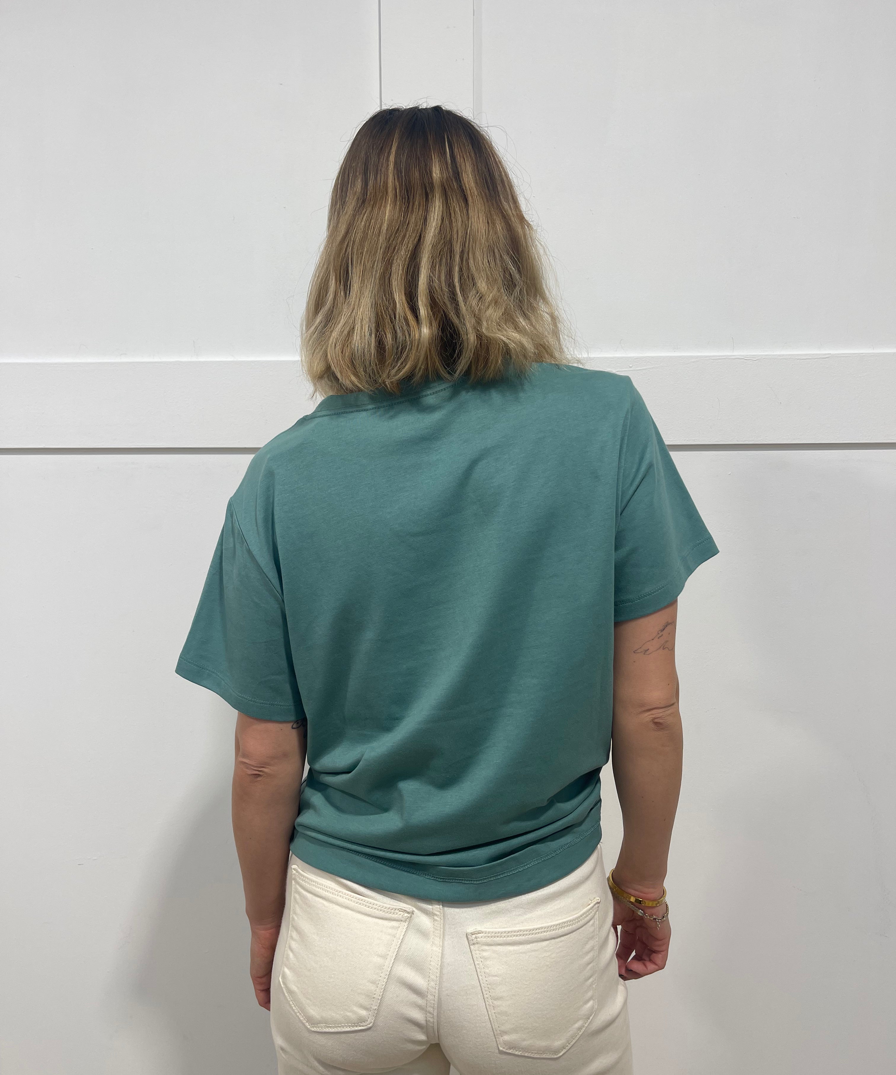Woman in seafoam t shirt